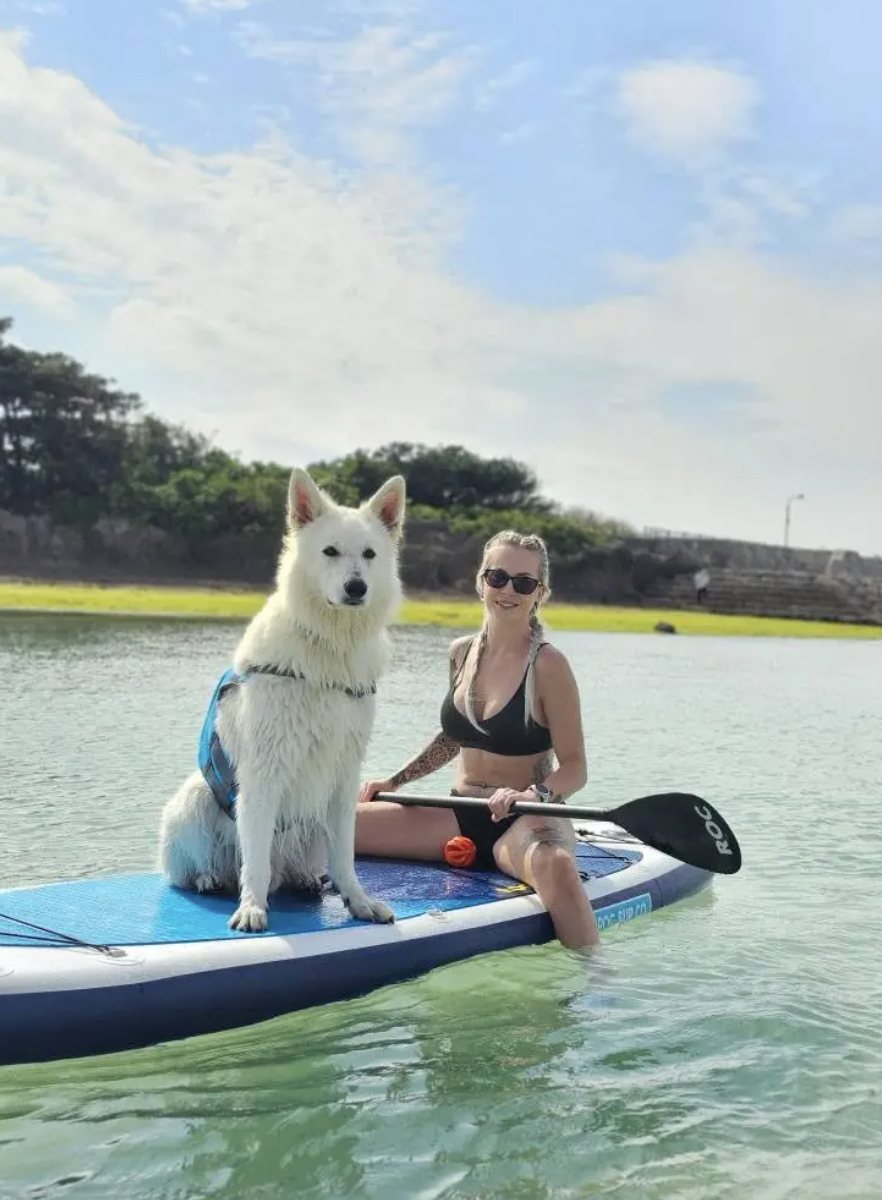 Nicole and Neo on a paddleboard